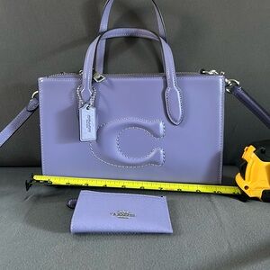 Coach purse with magnetic closer